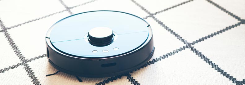 This image shows a robot vacuum on a carpet.