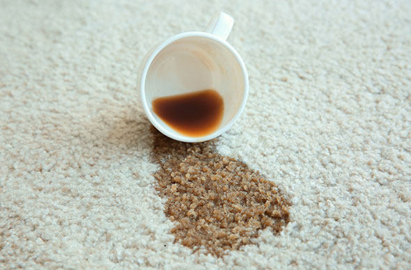 This image shows a spilled coffee on the carpet.
