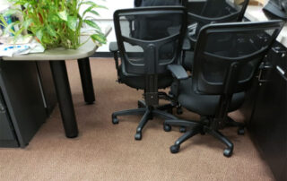 This image shows an office carpet that has been professionally cleaned.